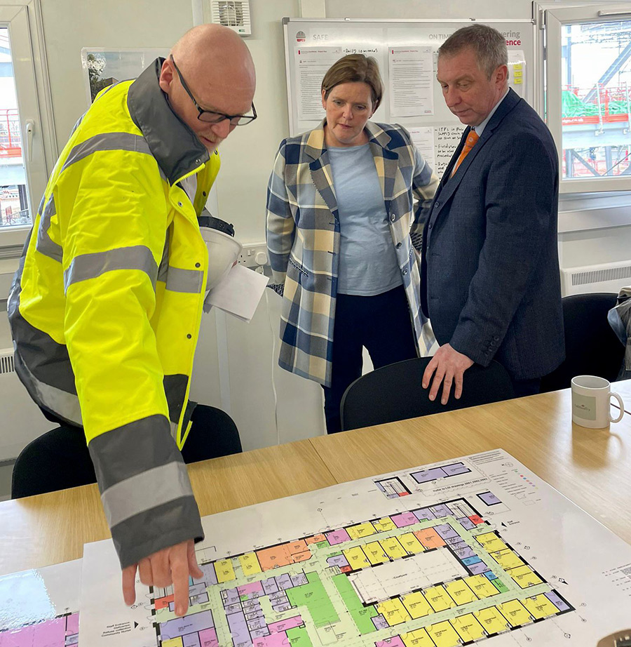 Mairead McCormick from KCHFT inspects the floorplan of the new centre