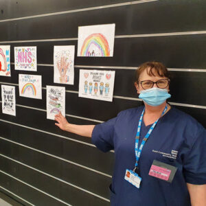 Vaccinator Jacqui Cotterill shows off some of the drawings done by children from Briary Primary School and St Richard's School to brighten up our Chatham centre.